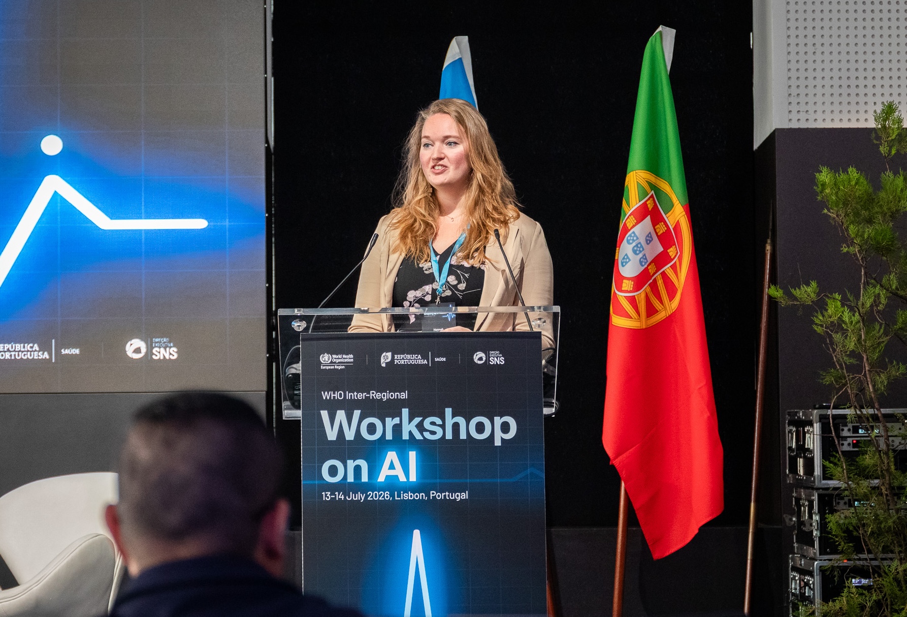 Hannah van Kolfschooten speaking at an international conference